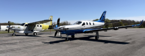      The initial Kodiak 100 Series III airplane provided by Daher Aircraft to Columbia Aircraft Sales is shown at the Groton,      Connecticut facility (at left), along with a TBM 980 that has since been delivered to a customer.
