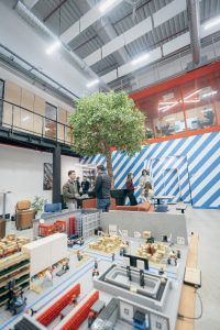 Photos from left to right: Collaborative space within Log’in by Daher; inauguration of the Log’in showroom; autonomous mobile robot demonstration. Photos: © Daher